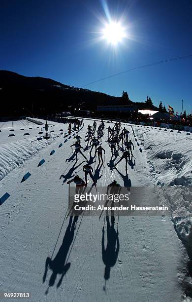 Athletes start the men's biathlon 15 km mass start on day 10 of the 2010 Vancouver Winter Olympics at Whistler Olympic Park Cross-Country Stadium on...