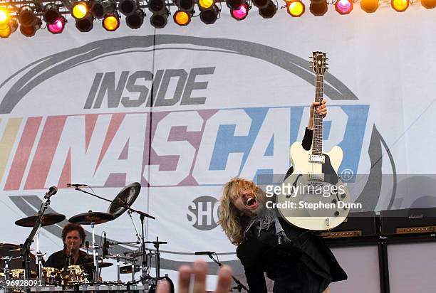 Guitarist Tommy Shaw of Styx performs prior to the NASCAR Sprint Cup Series Auto Club 500 at Auto Club Speedway on February 21, 2010 in Fontana,...