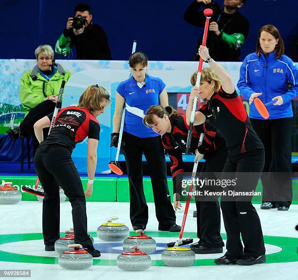 Allison Pottinger reacts as Carolyn Darbyshire , Cori Bartel and Susan O'Connor of Canada celebrate during the women's curling round robin game...