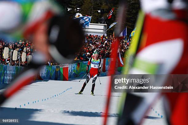 Simon Eder of Austria competes in the men's biathlon 15 km mass start on day 10 of the 2010 Vancouver Winter Olympics at Whistler Olympic Park...