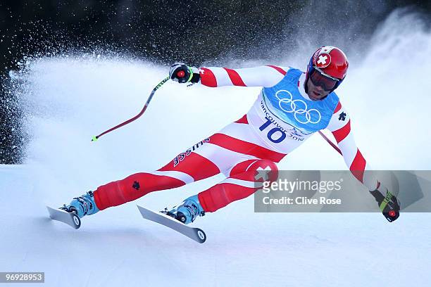 Didier Defago of Switzerland competes during the Alpine Skiing Men's Super Combined Downhill on day 10 of the Vancouver 2010 Winter Olympics at...