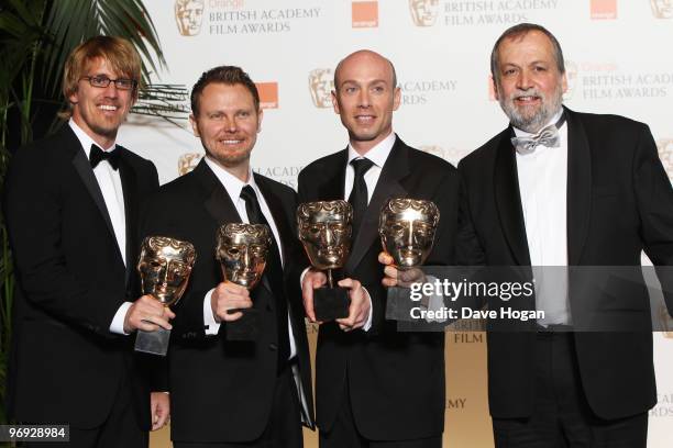 Joe Letteri, Stephen Rosenbaum, Richard Banehan and Andrew Jones pose with their best visual effects award in front of the winners boards at the...