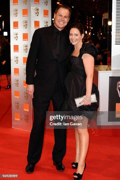 Businessman Peter Jones and guest attends the Orange British Academy Film Awards 2010 at the Royal Opera House on February 21, 2010 in London,...