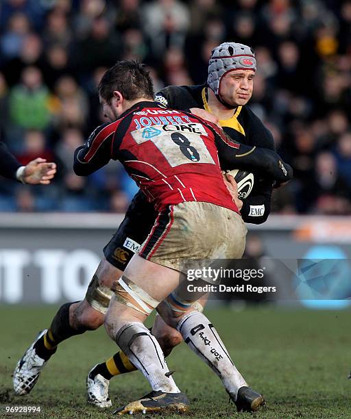 Dan Ward-Smith of Wasps is tackled by Ernst Joubert during the Guinness Premiership match between London Wasps and Saracens at Adams Park on February...