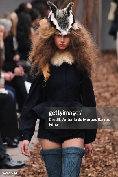 Model walks the runway at the Unique show for London Fashion Week Autumn/Winter 2010 at TopShop Venue on February 20, 2010 in London, England.