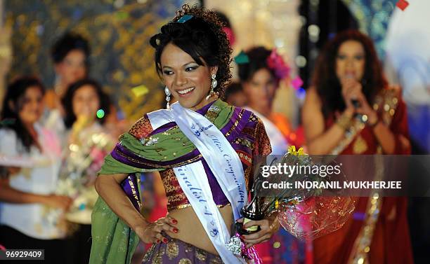 Indian transgender Bobby reacts after winning the 'Indian Super Queen' beauty paegant for the transgendered community in Mumbai on February 21, 2010....