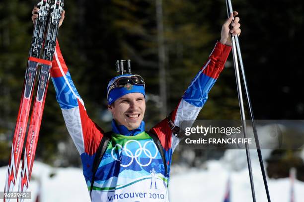 Russia's Evgeny Ustyugov reacts after the men's Biathlon 15 km mass start final at the Whistler Olympic Park during the Vancouver Winter Olympics on...