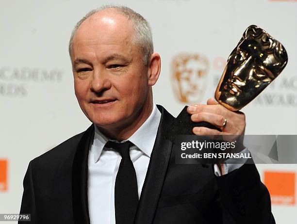 Cinematographer Barry Ackroyd poses for photographers with his British Academy of Film Award for 'Cinematography' for 'The Hurt Locker' at the Royal...
