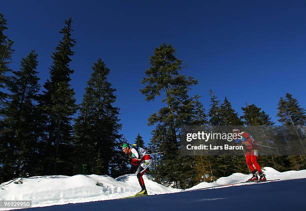 Simon Eder of Austria competes in the men's biathlon 15 km mass start on day 10 of the 2010 Vancouver Winter Olympics at Whistler Olympic Park...