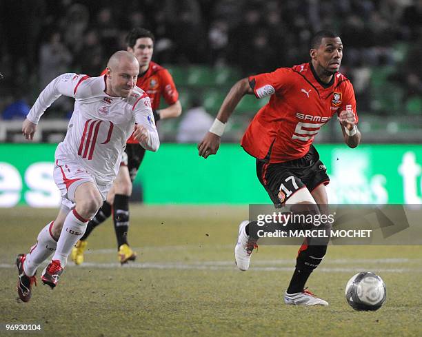 Rennes's midfielder Yann M'Vila vies with Lille's defender Florent Balmont during their French L1 football match on February 21, 2010 in Rennes,...