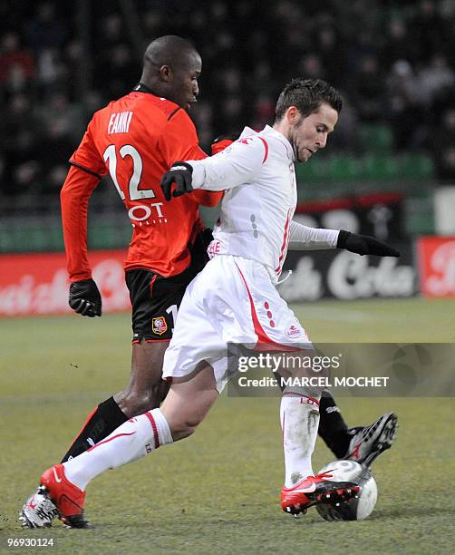 Rennes's midfielder Rod Fanni vies with Lille's defender Yohann Cabaye during their French L1 football match on February 21, 2010 in Rennes, western...