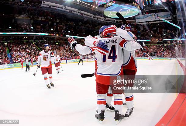 Jaromir Jagr of the Czech Republic skates toward his teammates as they celebrate with Tomas Plekanec after he scored a first period goal as goalie...