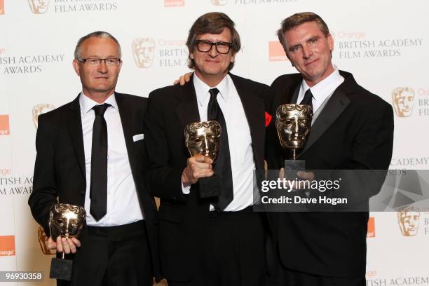 Rick Carter, Robert Stromberg and Kim Sinclair pose with their award for best production design for Avatar in front of the winners boards at the...
