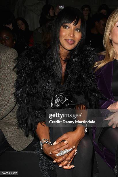 Naomi Campbell poses on the front row at the Vivienne Westwood Red Label show for London Fashion Week Autumn/Winter 2010 at on February 21, 2010 in...