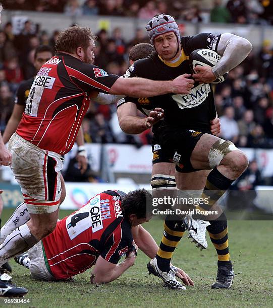 Dan Ward-Smith of Wasps holds off Richard Skuse during the Guinness Premiership match between London Wasps and Saracens at Adams Park on February 21,...