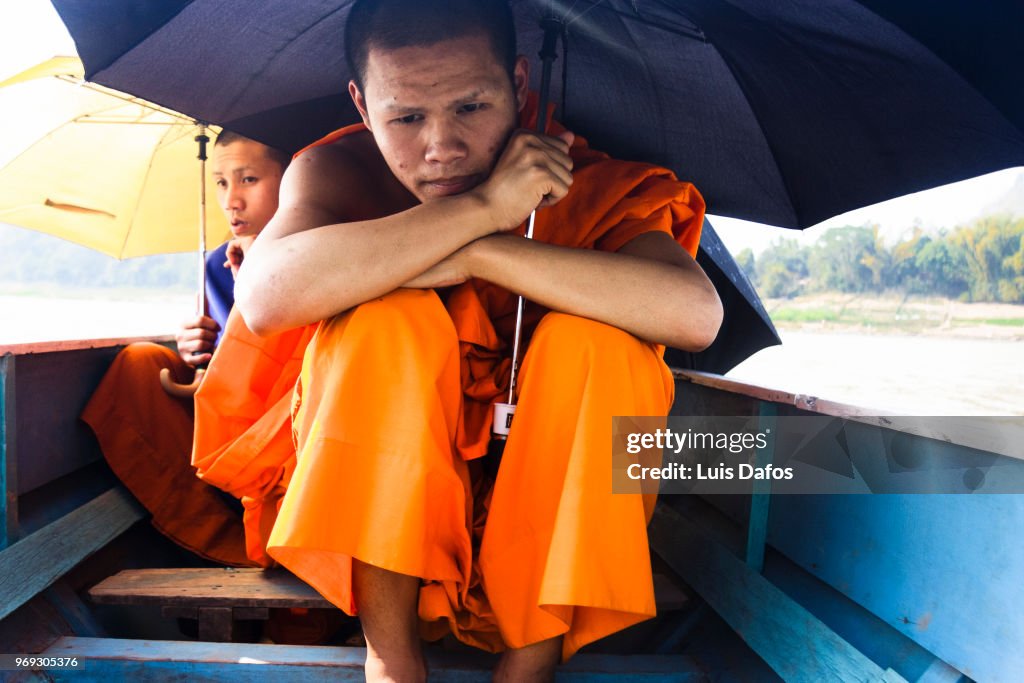 Buddhist monks on a rowboat
