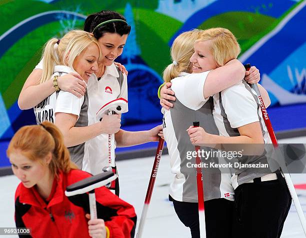 Denise Dupont , Camilla Jensen , Angelina Jensen and Madeleine Dupont of Denmark celebrates after defeating Germany during the women's curling round...