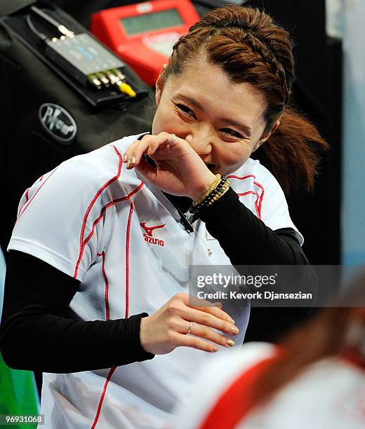 Mari Motohashi of Japan celebrates after defeating Russia, 12-9, during the women's curling round robin game between Japan and Russia on day 10 of...