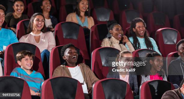 multi-ethnic children, teens, young adults in theater - movie theater imagens e fotografias de stock