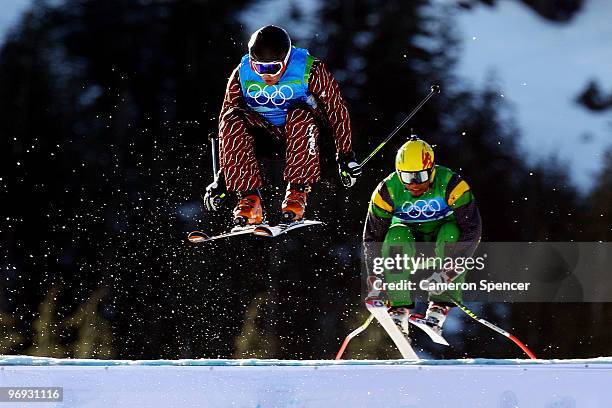 Errol Kerr of Jamaica and Davey Barr of Canada compete in a men's ski cross race on day ten of the Vancouver 2010 Winter Olympics at Cypress Mountain...