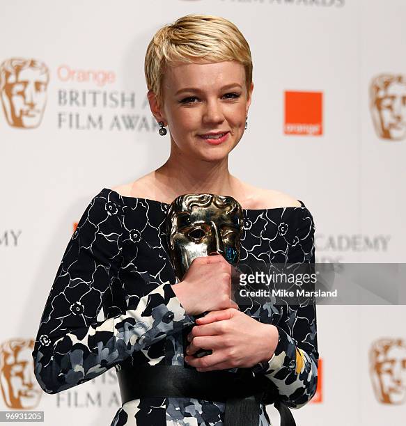 Carey Mulligan poses with the Best Actress Award for An Education during the The Orange British Academy Film Awards 2010, at The Royal Opera House on...