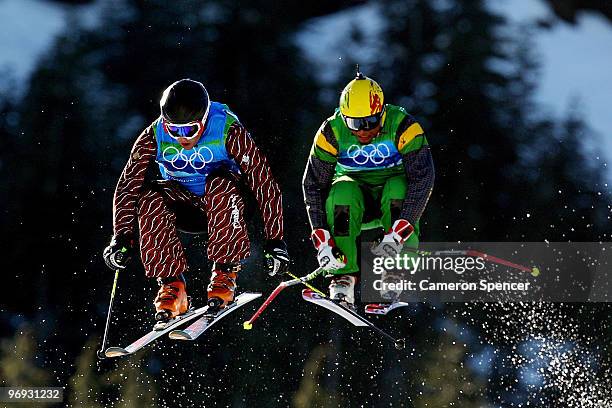 Errol Kerr of Jamaica and Davey Barr of Canada compete in a men's ski cross race on day ten of the Vancouver 2010 Winter Olympics at Cypress Mountain...