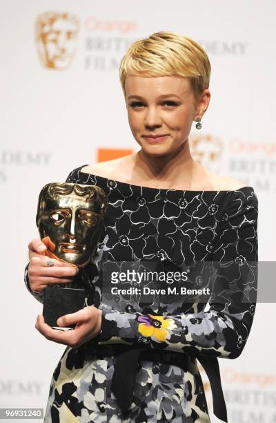 Carey Mulligan poses with the Best Actress Award for An Education during the The Orange British Academy Film Awards 2010, at The Royal Opera House on...
