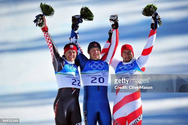 Silver medalist Ivica Kostelic of Croatia, Gold medalist Bode Miller of the United States and Bronze medalist Silvan Zurbriggen of Switzerland...