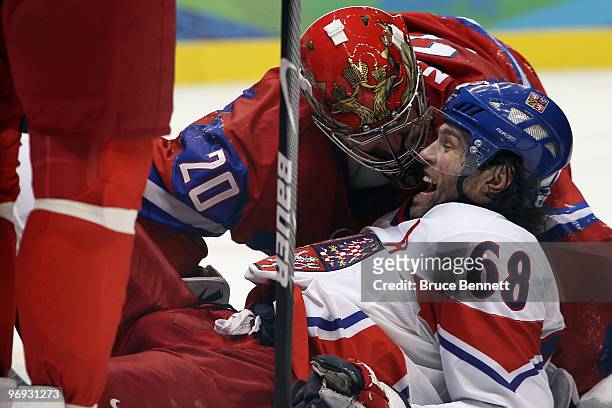Jaromir Jagr of Czech Republic reacts next to goalkeeper Evgeni Nabokov of Russia during the ice hockey men's preliminary game between Russia and...