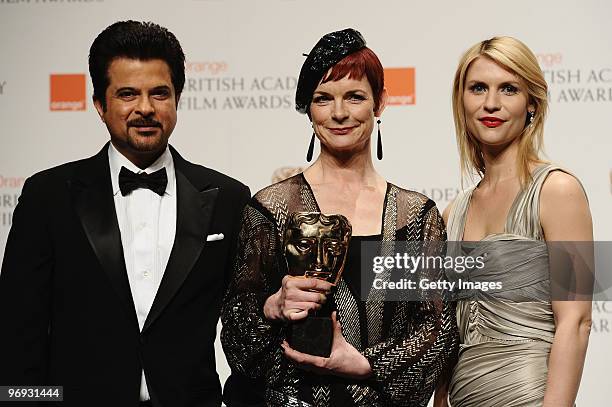 Presenters Anil Kapoor and Claire Danes pose with Sandy Powell as she wins the award for Costume Design for the film The Young Victoria during the...