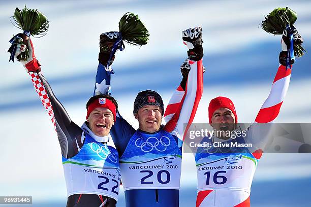 Silver medalist Ivica Kostelic of Croatia, Gold medalist Bode Miller of the United States and Bronze medalist Silvan Zurbriggen of Switzerland...