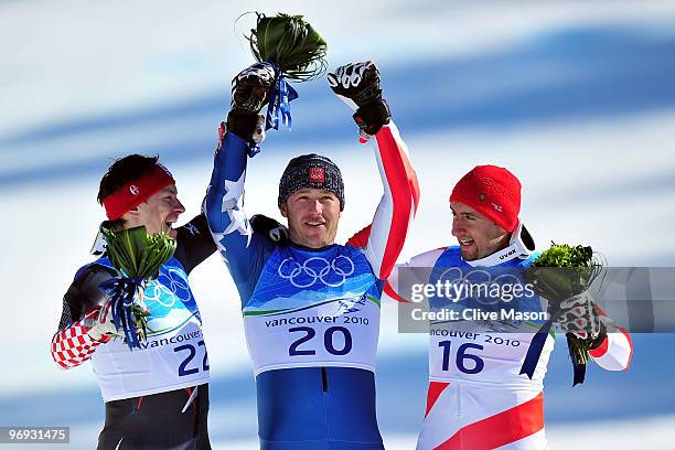 Silver medalist Ivica Kostelic of Croatia, Gold medalist Bode Miller of the United States and Bronze medalist Silvan Zurbriggen of Switzerland...