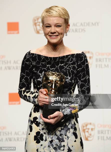 Carey Mulligan poses with the award for Leading Actress for the film, An Education, during the Orange British Academy Film Awards 2010 at the Royal...