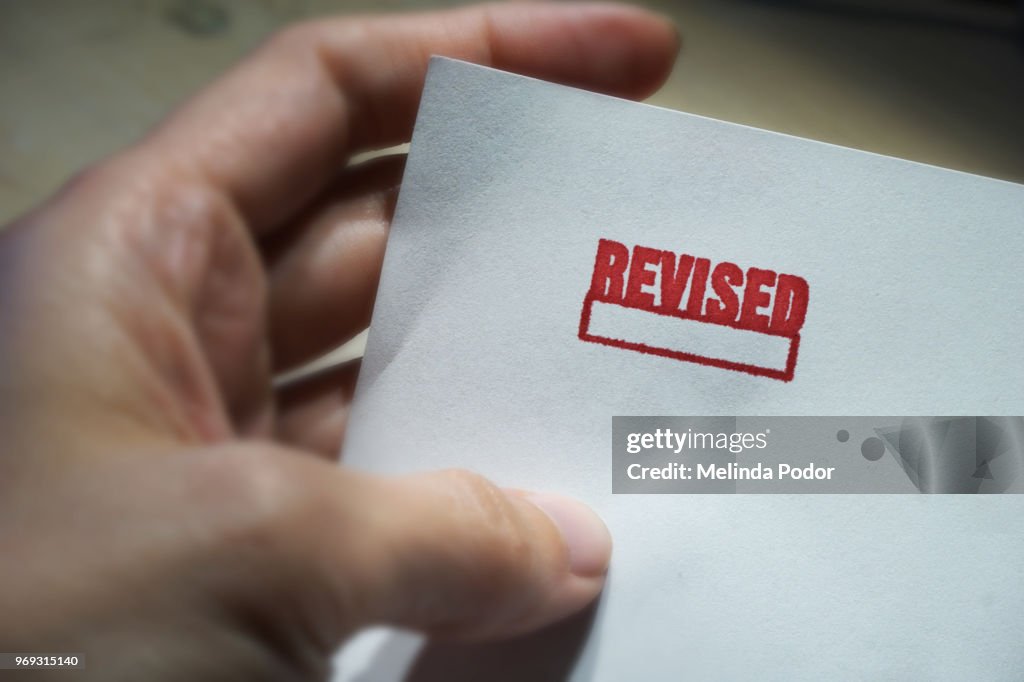 Revised Back The Word Revised Stamped On A Piece Of Paper High-Res Stock Photo ...