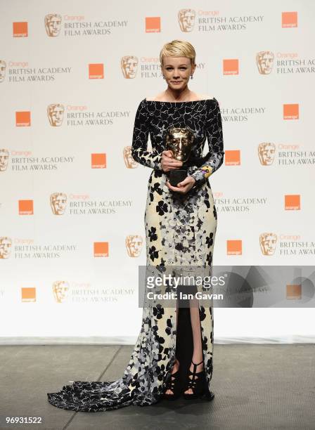 Carey Mulligan poses with the award for Leading Actress for the film, An Education, during the Orange British Academy Film Awards 2010 at the Royal...