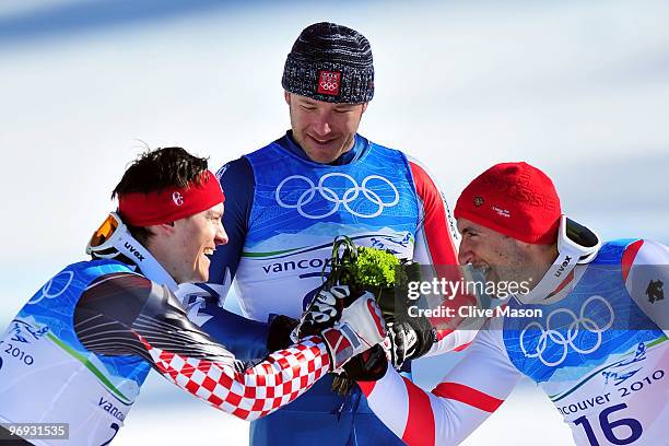 Silver medalist Ivica Kostelic of Croatia, Gold medalist Bode Miller of the United States and Bronze medalist Silvan Zurbriggen of Switzerland...