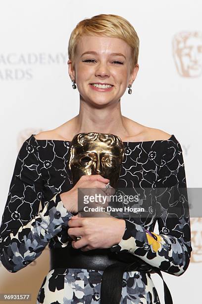 Carey Mulligan poses with her best actress award in front of the winners boards at the Orange British Academy Film Awards held at The Royal Opera...
