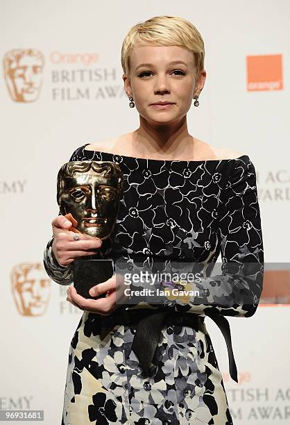 Carey Mulligan poses with the award for Leading Actress for the film, An Education, during the Orange British Academy Film Awards 2010 at the Royal...