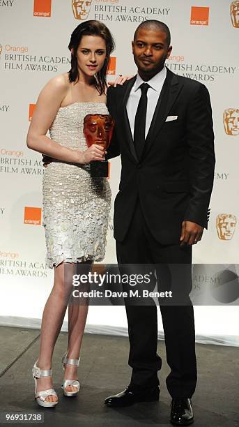 Kristen Stewart poses with the Orange Rising Star Award presented by Noel Clarke during the The Orange British Academy Film Awards 2010, at The Royal...