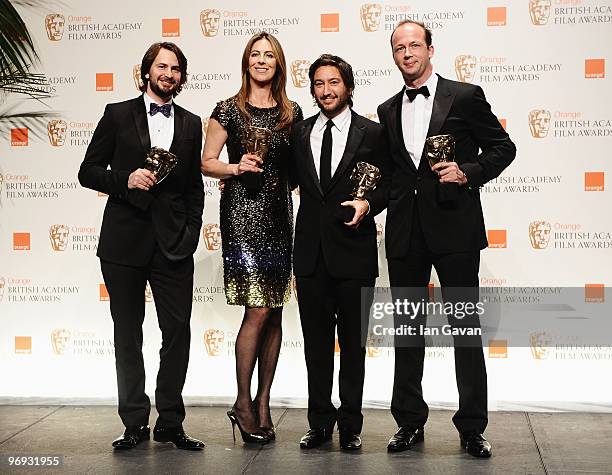 Mark Boal, Kathryn Bigelow, Greg Shapiro and Nicholas Chartier pose with the award for Best Film, The Hurt Locker, during the Orange British Academy...