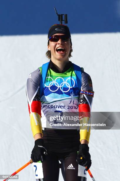 Magdalena Neuner of Germany celebrates winning gold in the women's biathlon 12.5 km mass start on day 10 of the 2010 Vancouver Winter Olympics at...