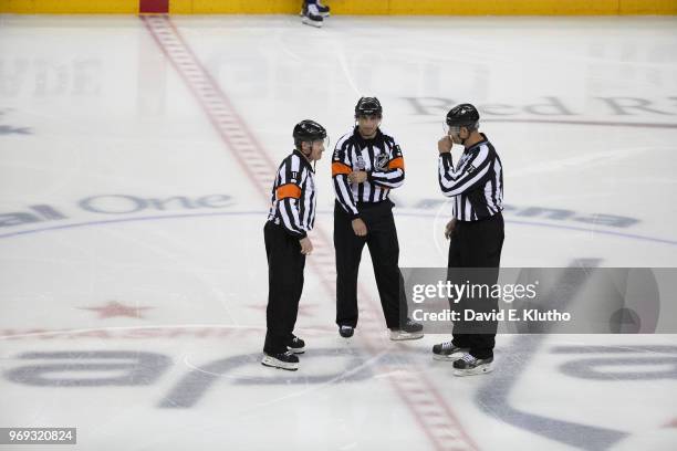 Referees Kelly Sutherland , Chris Rooney and Linesman Derek Amell before start of Washington Capitals vs Vegas Golden Knights game at Capital One...