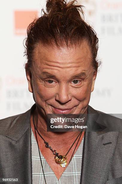 Mickey Rourke poses in front of the winners boards at the Orange British Academy Film Awards held at The Royal Opera House on February 21, 2010 in...