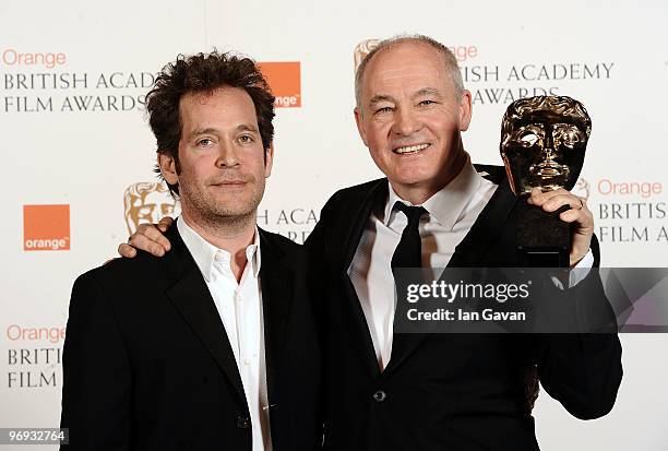 Citation reader Tom Hollander poses with Barry Ackroyd as he receives the award for Best Cinematography for The Hurt Locker during the Orange British...