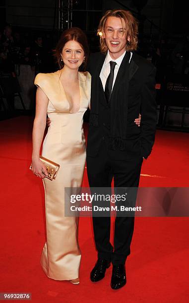 Bonnie Wright and Jamie Campbell Bower arrive at the Orange British Academy Film Awards 2010, at The Royal Opera House on February 21, 2010 in...