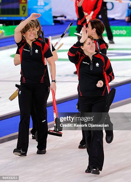 Cori Bartel , Cheryl Bernard , Carolyn Darbyshire and Susan O'Connor of Canada celebrate after defeating USA during the women's curling round robin...