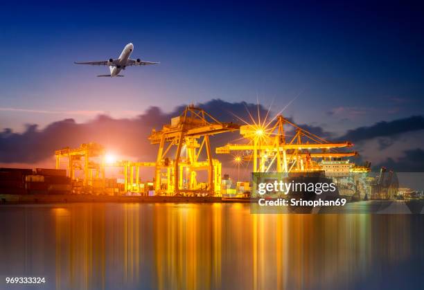 logistics and transportation container cargo ship and cargo plane with working crane bridge in shipyard background, logistic import export background and transport industry. - air freight transportation stock pictures, royalty-free photos & images