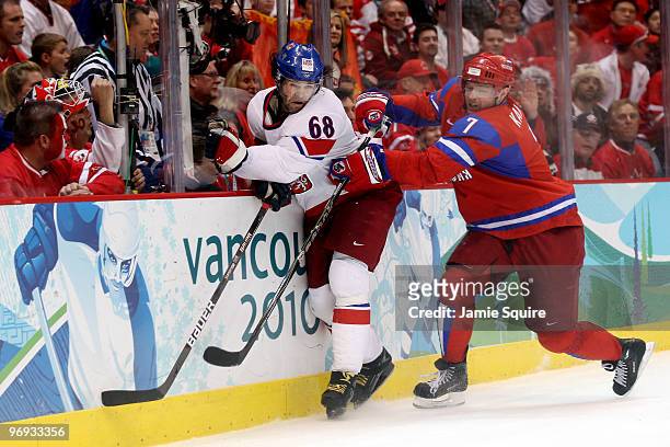 Jaromir Jagr of Czech Republic battles for the puck with Dmitri Kalinin of Russia during the ice hockey men's preliminary game between against Russia...