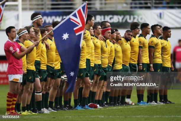 Australia's players line up during their national anthem prior to the Rugby Union World Cup U20 championship match between South Africa and France at...
