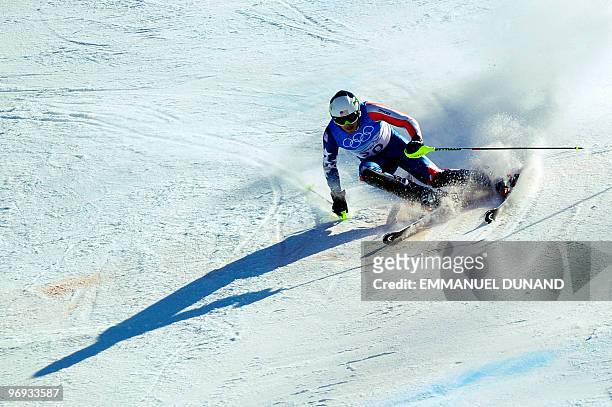 S Bode Miller clears a gate during the Men's Vancouver 2010 Winter Olympics Super Combined event at Whistler Creek side Alpine skiing venue on...